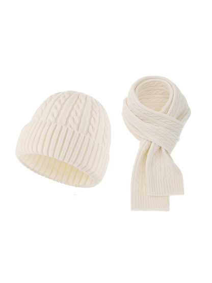 Ivory cable-knit hat and scarf set on a white background