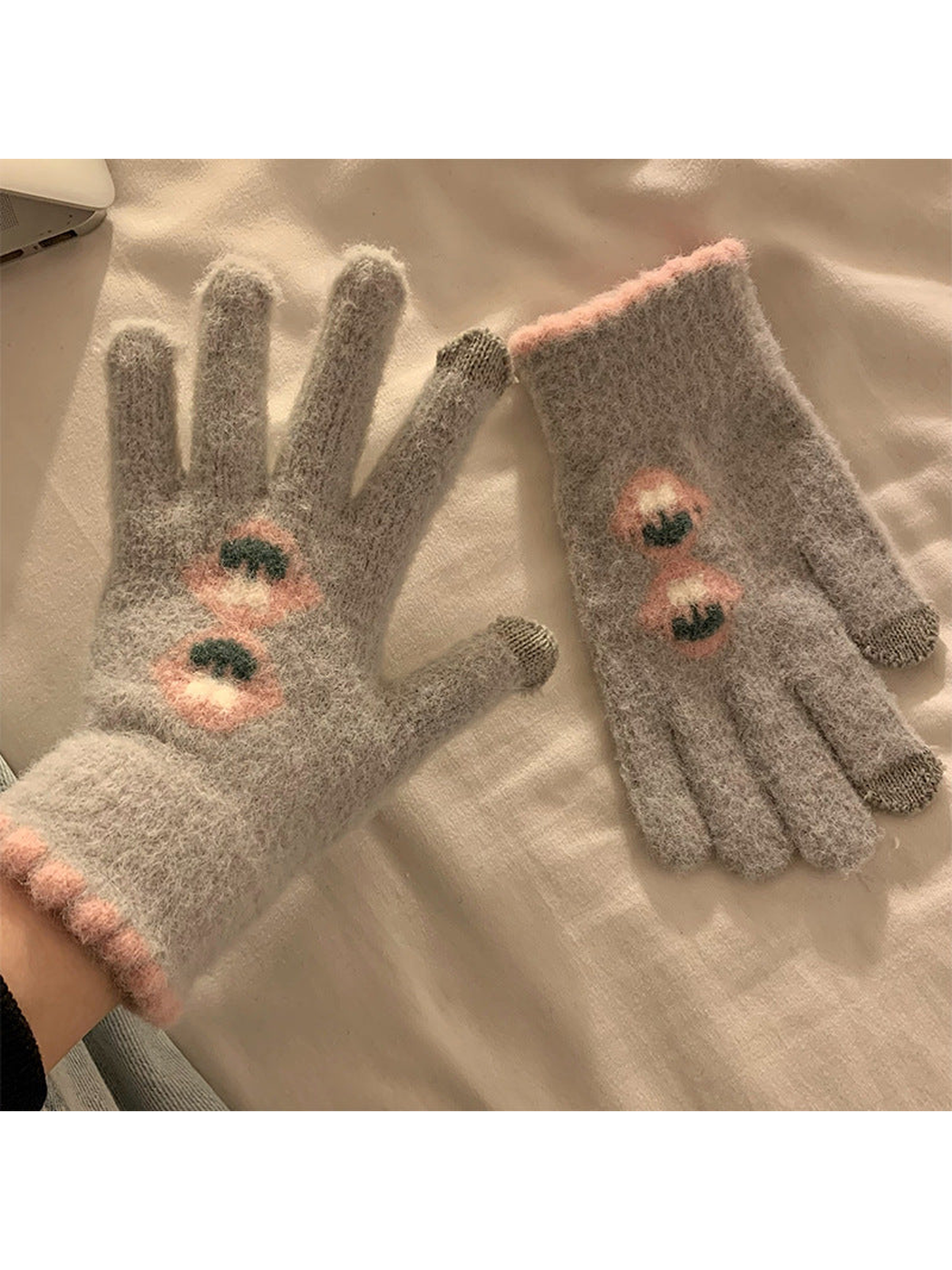 Deep gray fuzzy gloves with stacked floral motifs and pink trim