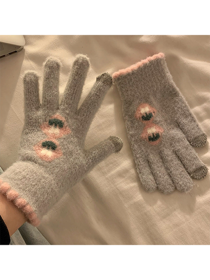 Deep gray fuzzy gloves with stacked floral motifs and pink trim