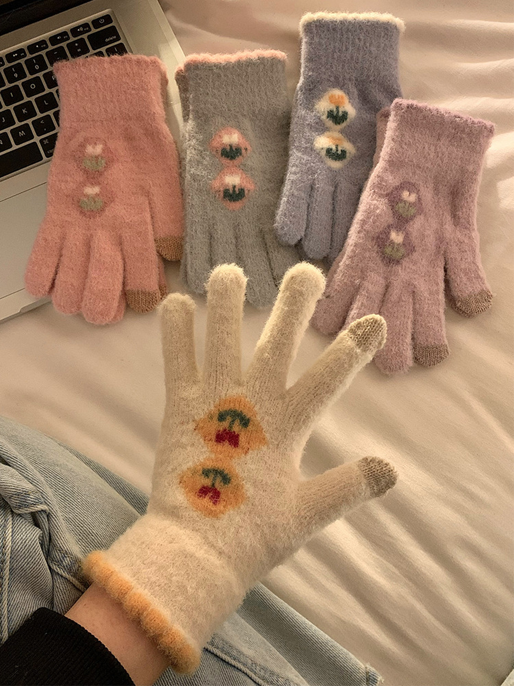 Cream glove worn in front of pink, gray, blue-gray and purple color options