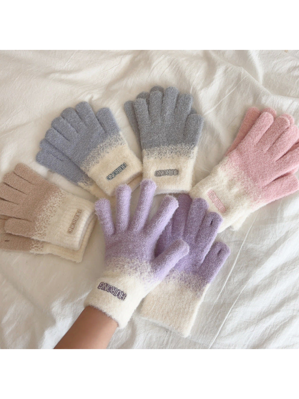 Pink, blue, gray, purple and beige two-tone gloves arranged together