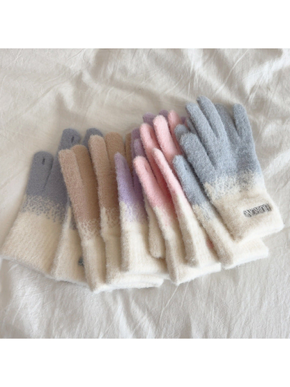 Assorted two-tone gloves stacked to show their side profiles and cuffs