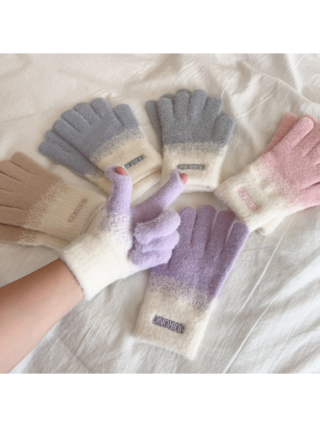 Purple gloves worn with open thumb and index fingertips beside assorted colors