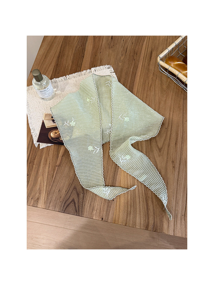 Green pleated triangle scarf with fine stripes and floral sprigs