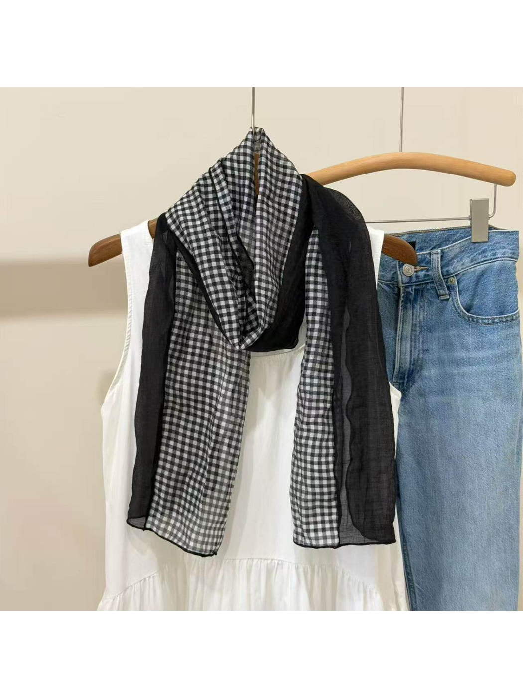 Black sheer scarf with contrasting gingham-check panels, draped view