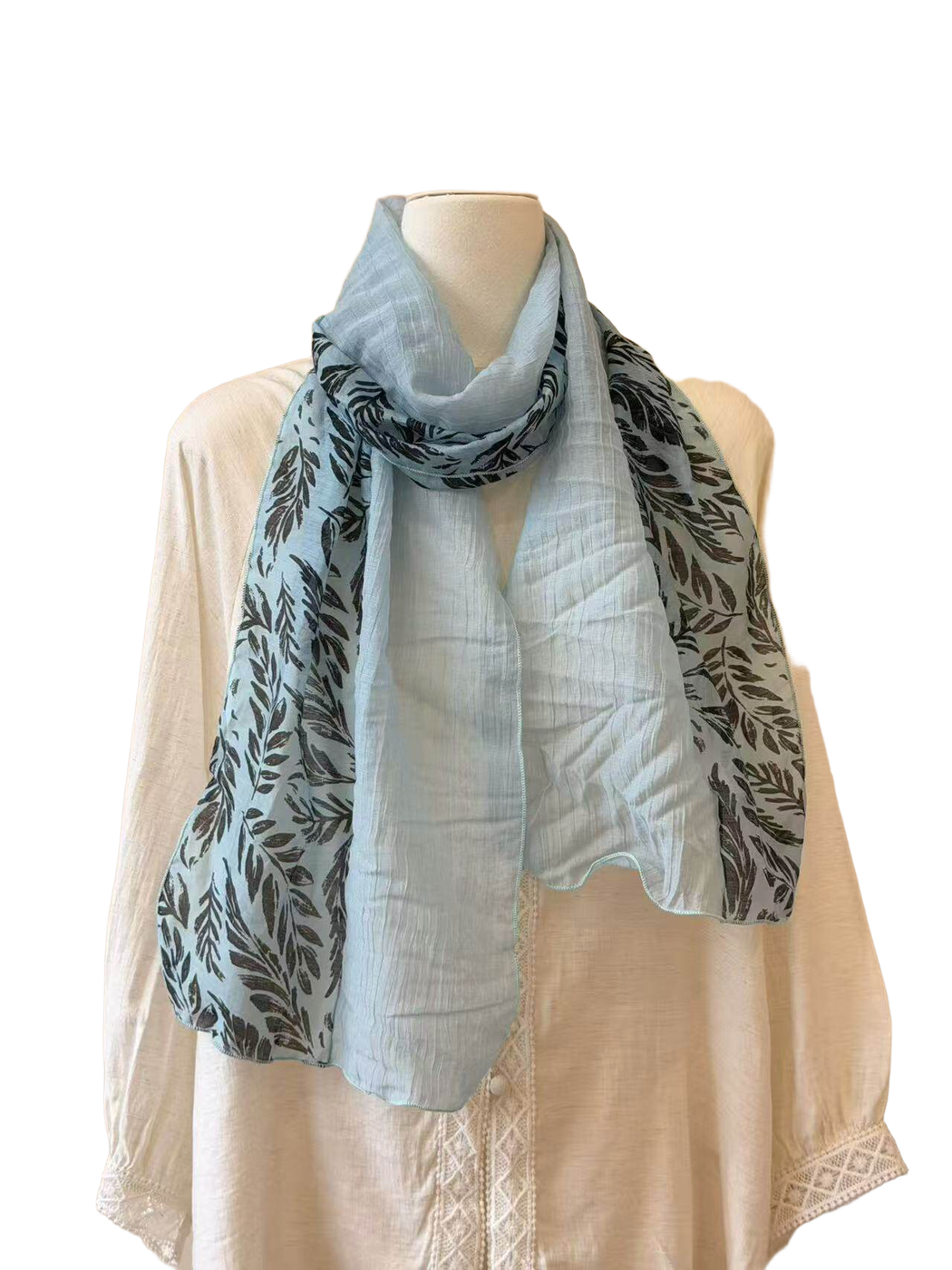 Light blue sheer scarf with contrasting dark leaf-print panels