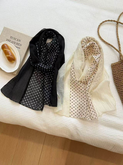 Black and beige polka-dot scarves displayed together