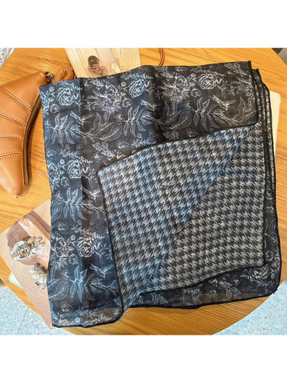 Close-up of the navy scarf's floral face and houndstooth reverse