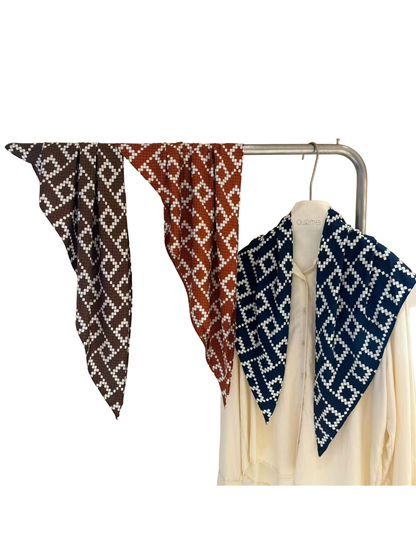 Brown, red and navy geometric diamond triangle scarves displayed together