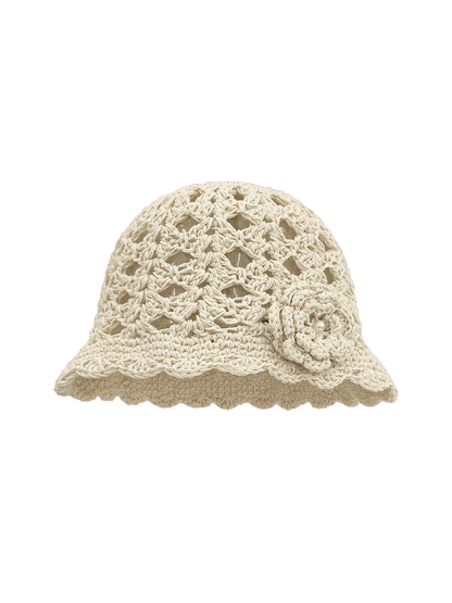 Ivory openwork beanie with scalloped brim and flower applique, front view
