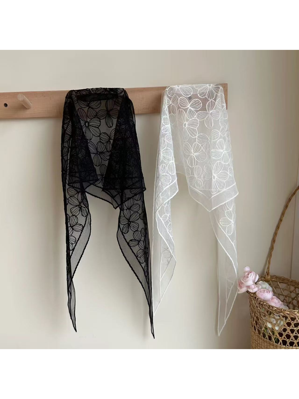 Black and white sheer floral scarves with tapered ends displayed together