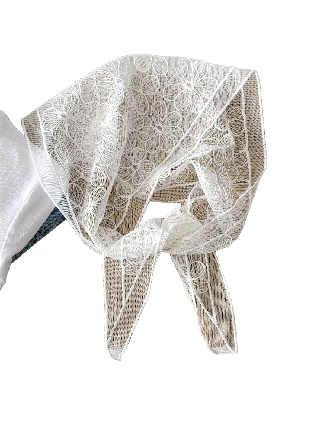 White sheer floral scarf loosely tied to show its embroidered border and tapered ends