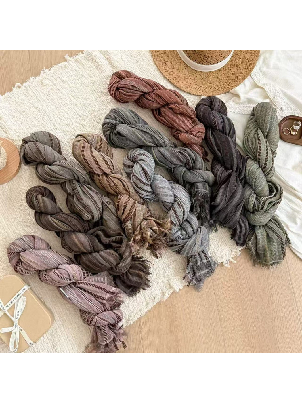 Striped scarves in nine muted colors arranged together