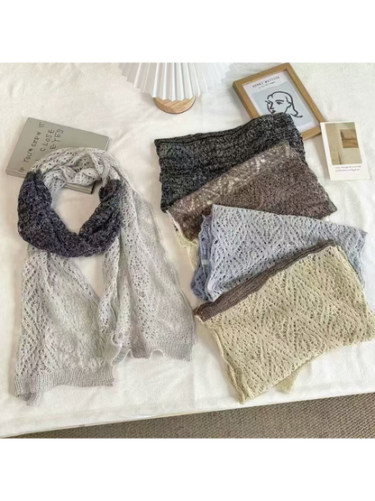 Two-tone openwork scarves arranged flat and folded to show their patterns