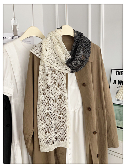 Ivory and black openwork scarf draped in a long front view