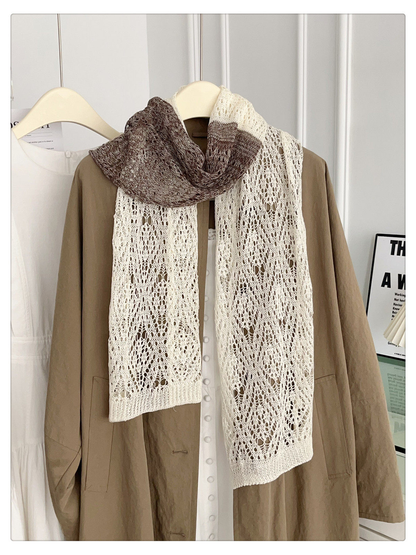 Ivory and brown openwork scarf hanging in a full front view