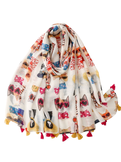Multicolor cat-print scarf draped with pink and mustard tassels