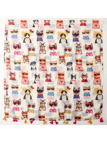 Multicolor cat-print scarf laid flat with pink and mustard tassels