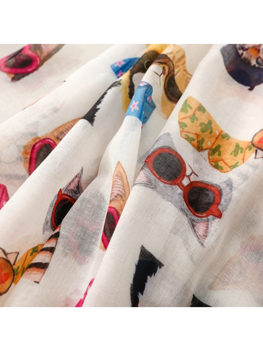 Close-up of the cat print and fine grid-like scarf weave