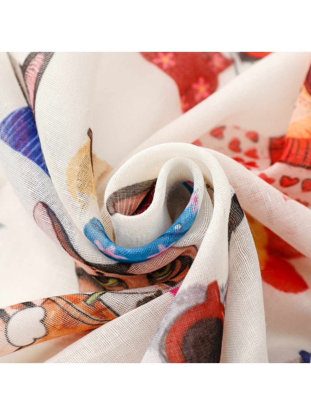 Close-up of overlapping folds showing the semi-sheer scarf surface