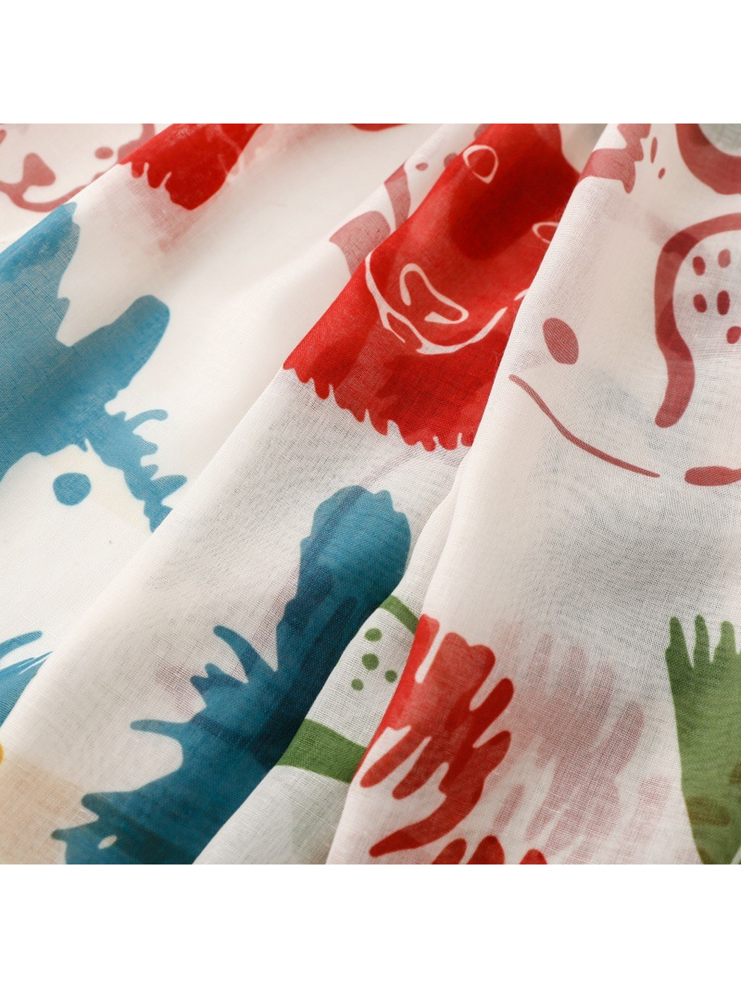 Close-up of the multicolor dog print and fine scarf weave