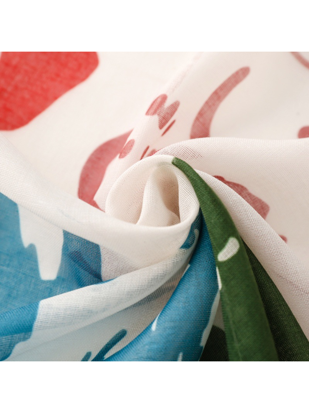 Close-up of the semi-sheer woven scarf gathered into folds
