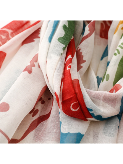 Close-up of the red, blue and green dog print across draped folds