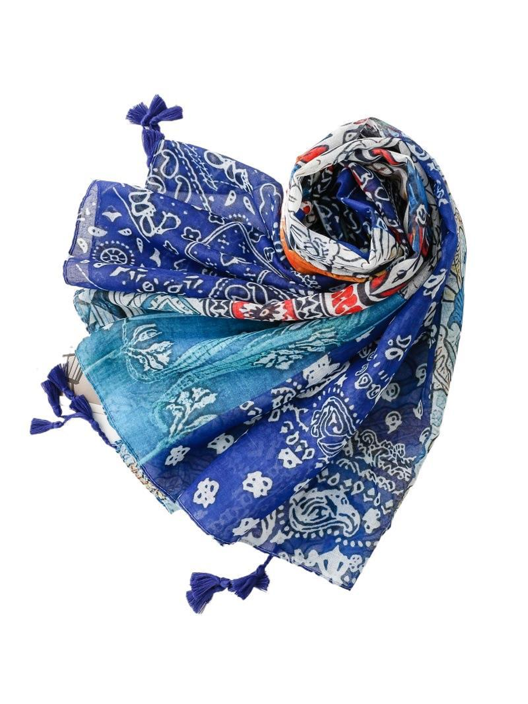 Blue multicolor patchwork-print scarf arranged in a loose spiral with tassels
