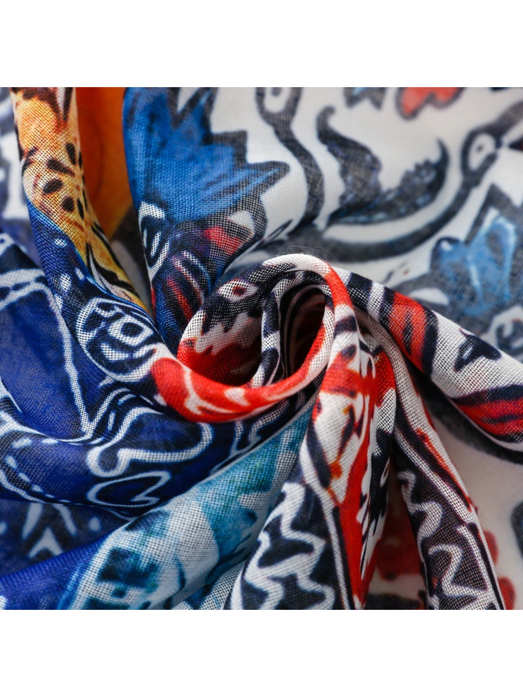 Close-up of the scarf's fine woven-look texture and multicolor printed folds
