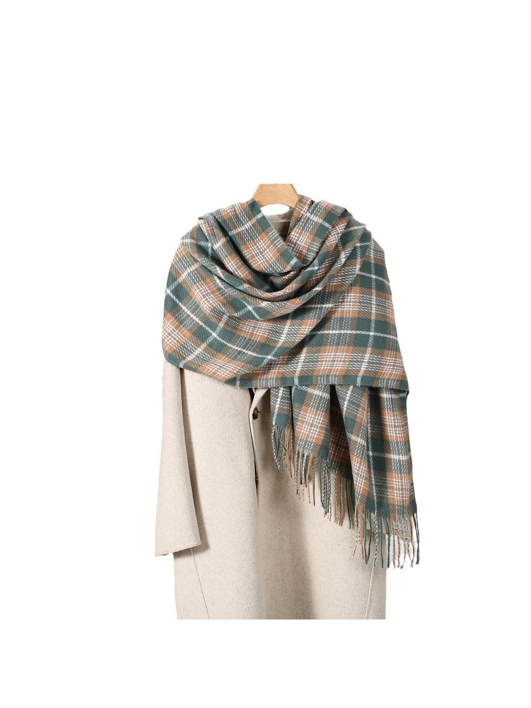 Green plaid scarf draped over a cream coat