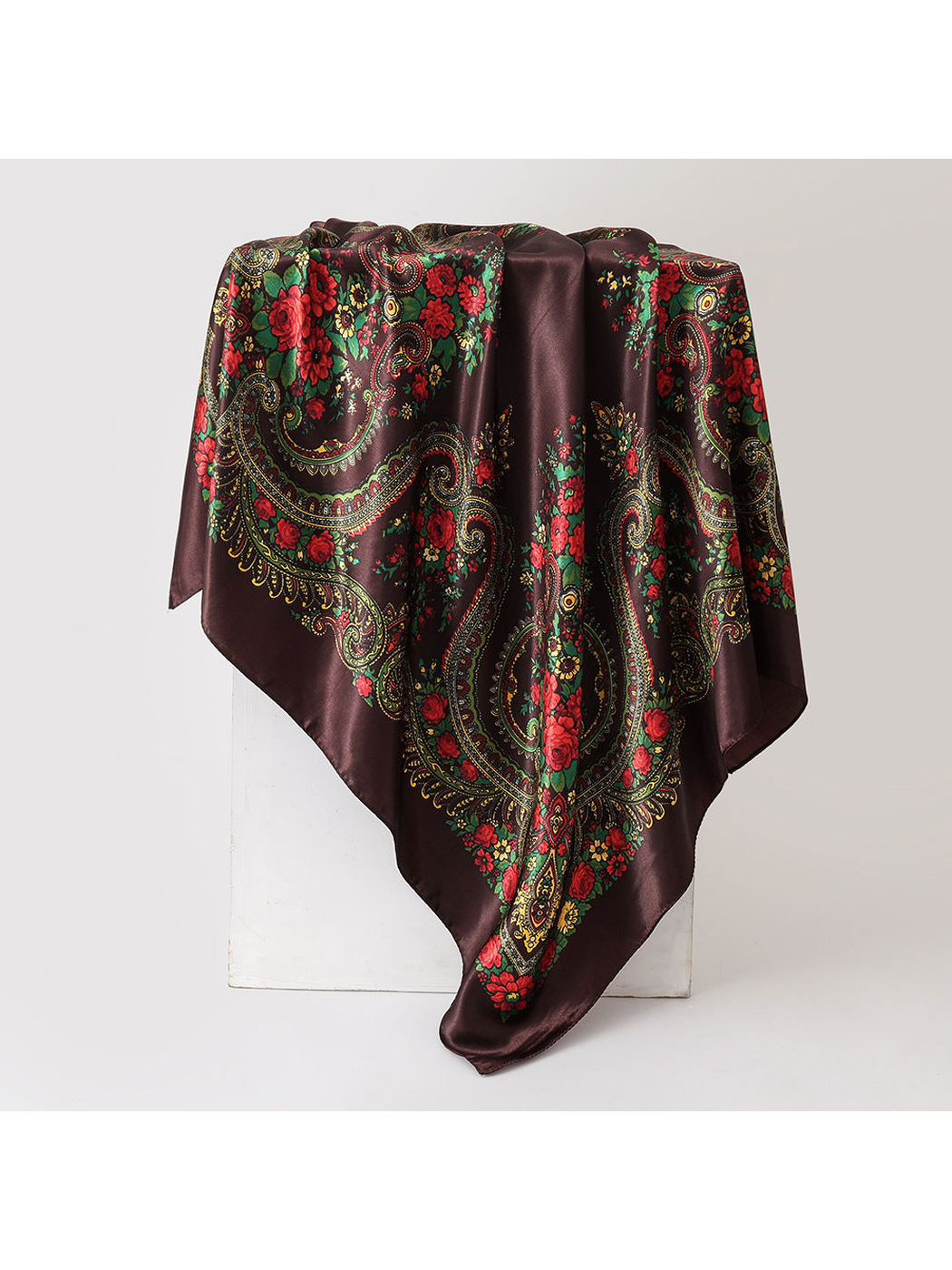 Dark brown square scarf with red floral and paisley pattern, draped view