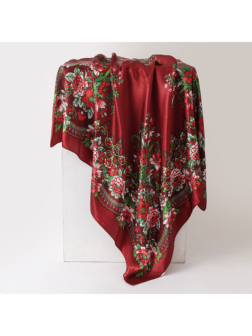 Burgundy floral square scarf in a draped display