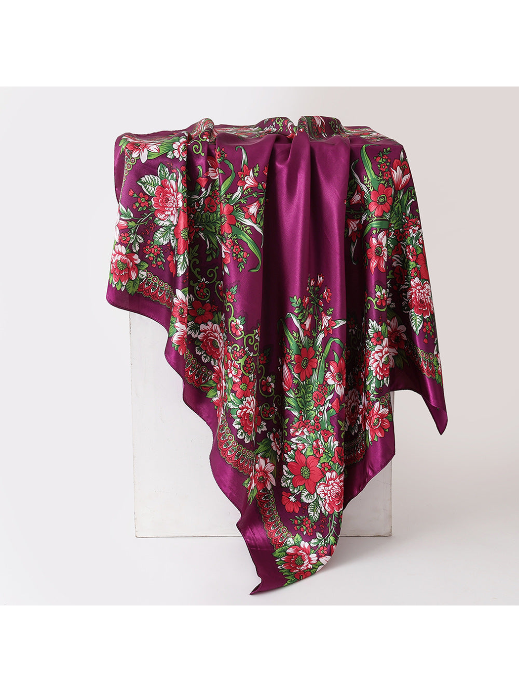 Fuchsia floral square scarf in a draped display