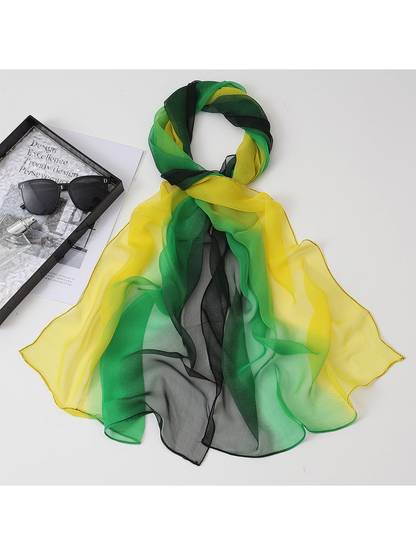 Yellow, green and black gradient scarf arranged in a draped loop