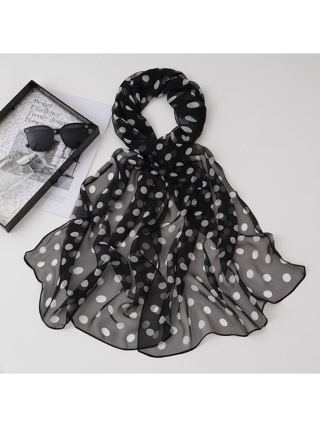 Black sheer scarf with white polka dots, draped view