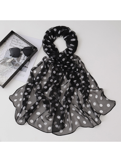 Black sheer scarf with white polka dots, draped view