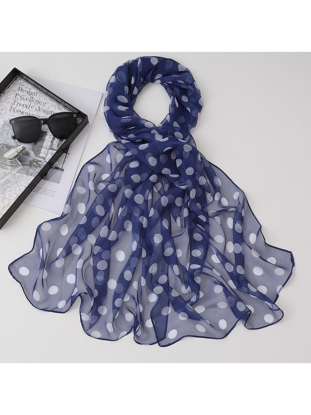 Navy sheer scarf with white polka dots, draped view