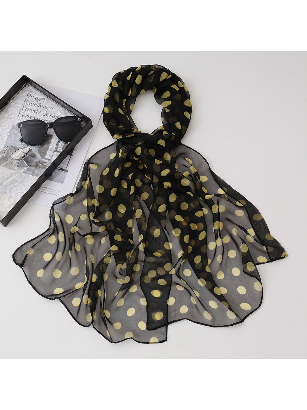 Black sheer scarf with pale yellow polka dots, draped view