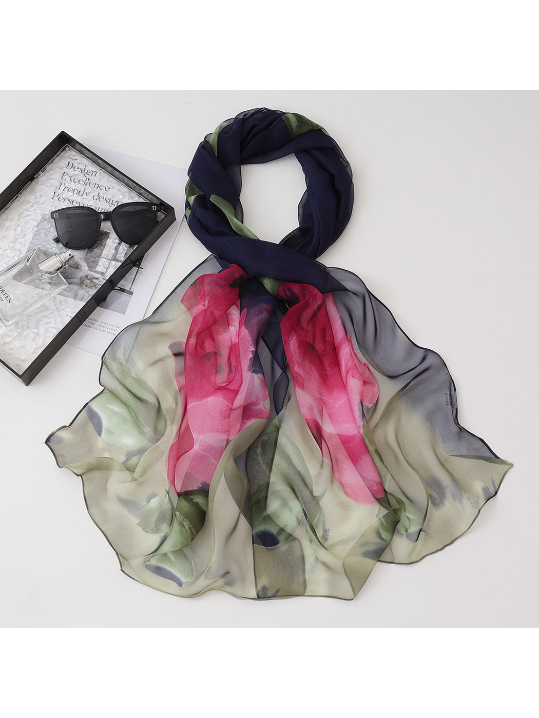 Navy floral scarf with pink blossoms and green leaves