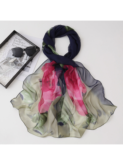Navy floral scarf with pink blossoms and green leaves