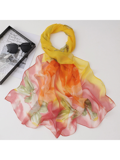 Yellow floral scarf with orange, pink and green accents