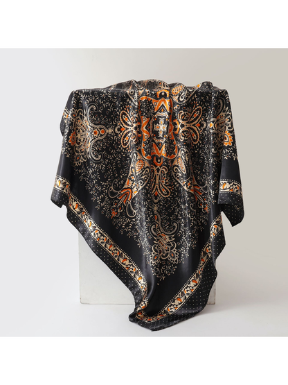 Black square scarf with orange paisley print and ornamental border