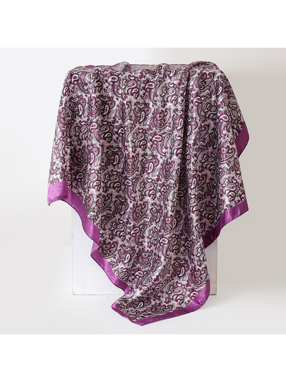 Purple paisley square scarf with a solid border, draped view