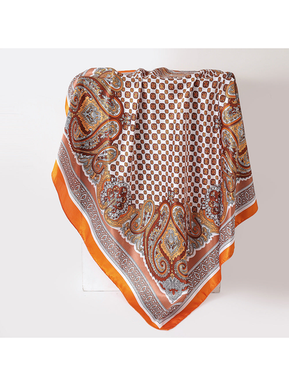 Orange paisley square scarf displayed in a full draped view