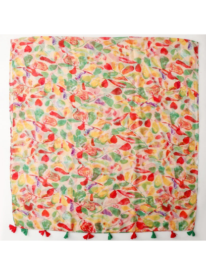 Multicolor abstract leaf print scarf laid flat with red and green tassels
