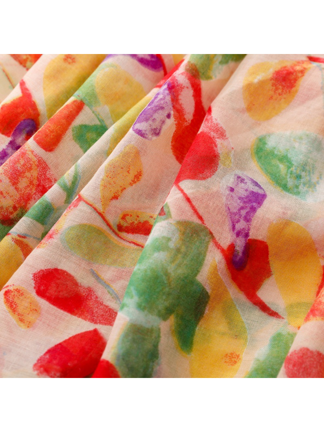 Close-up of the multicolor abstract leaf print across soft folds