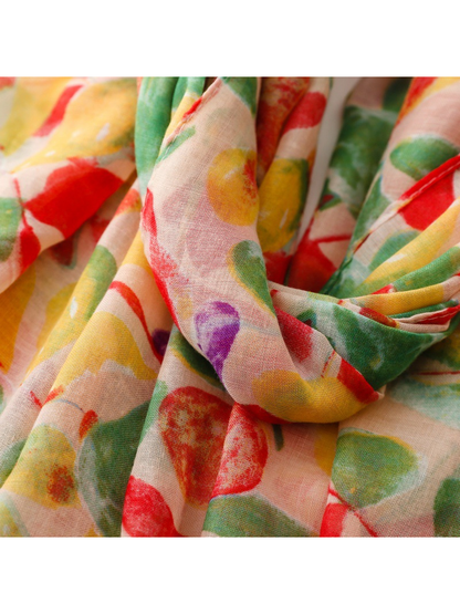 Close-up of the lightweight scarf draped in overlapping folds