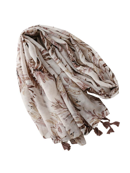 Ivory botanical-print scarf arranged in a flowing draped view