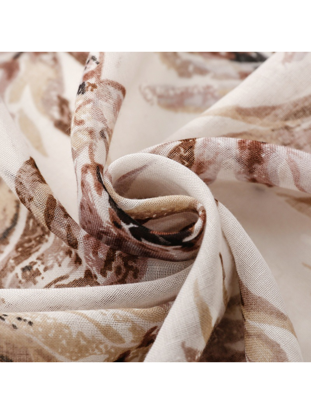 Close-up of the scarf's fine semi-sheer weave and botanical print