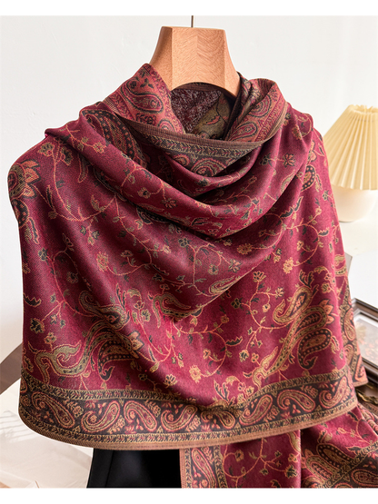 Close-up of the burgundy scarf drape and contrasting paisley border